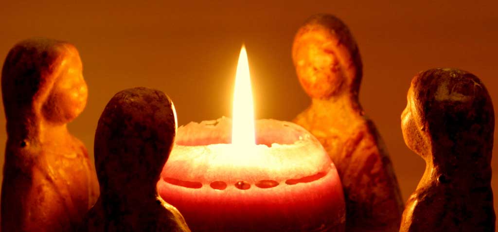 wax figures around candle
